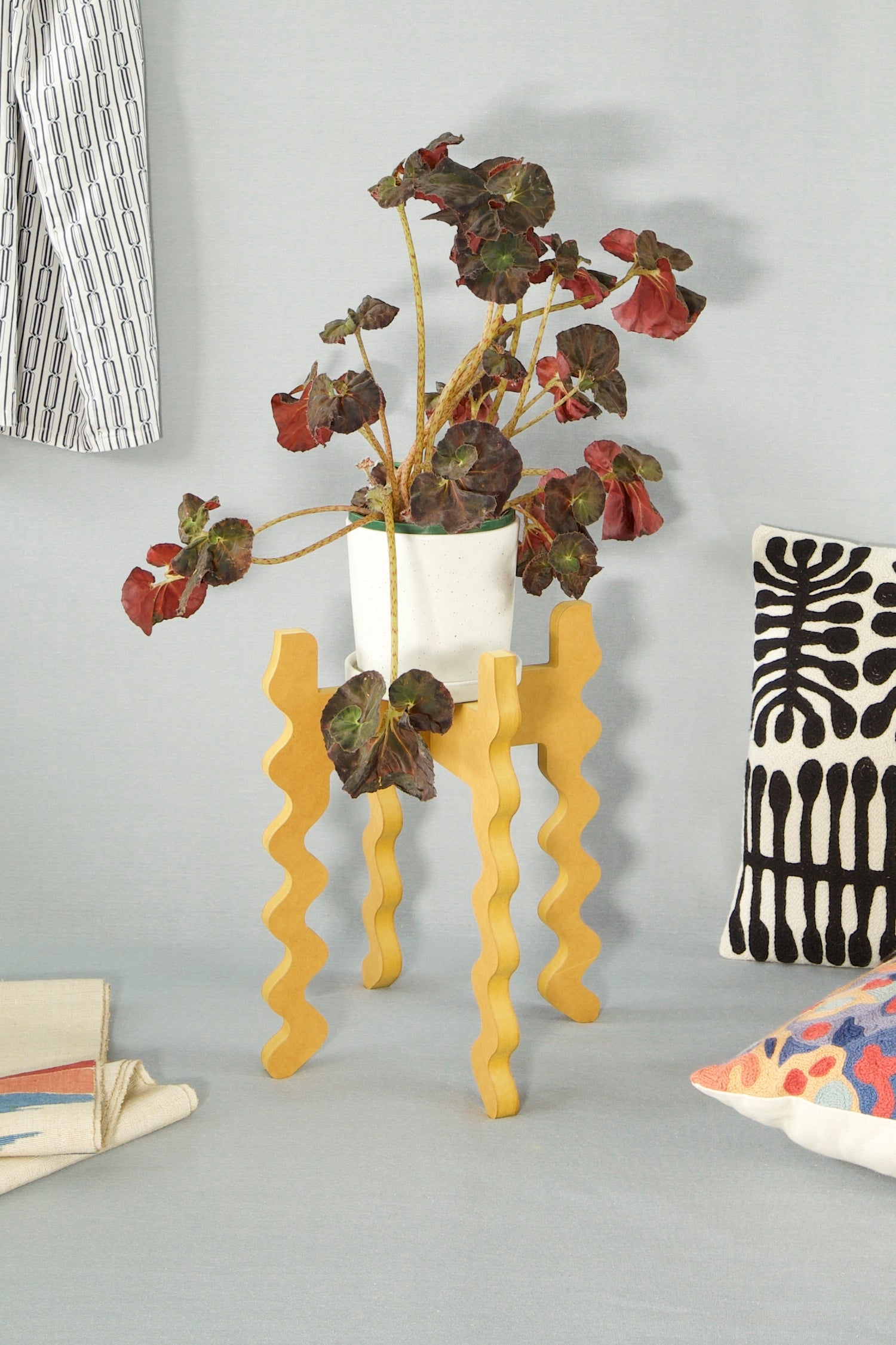 Xigglie Saffron Middie Wide Plant Stand.  Australian designed and made in yellow moisture resistant MDF. Supporting indoor plant.