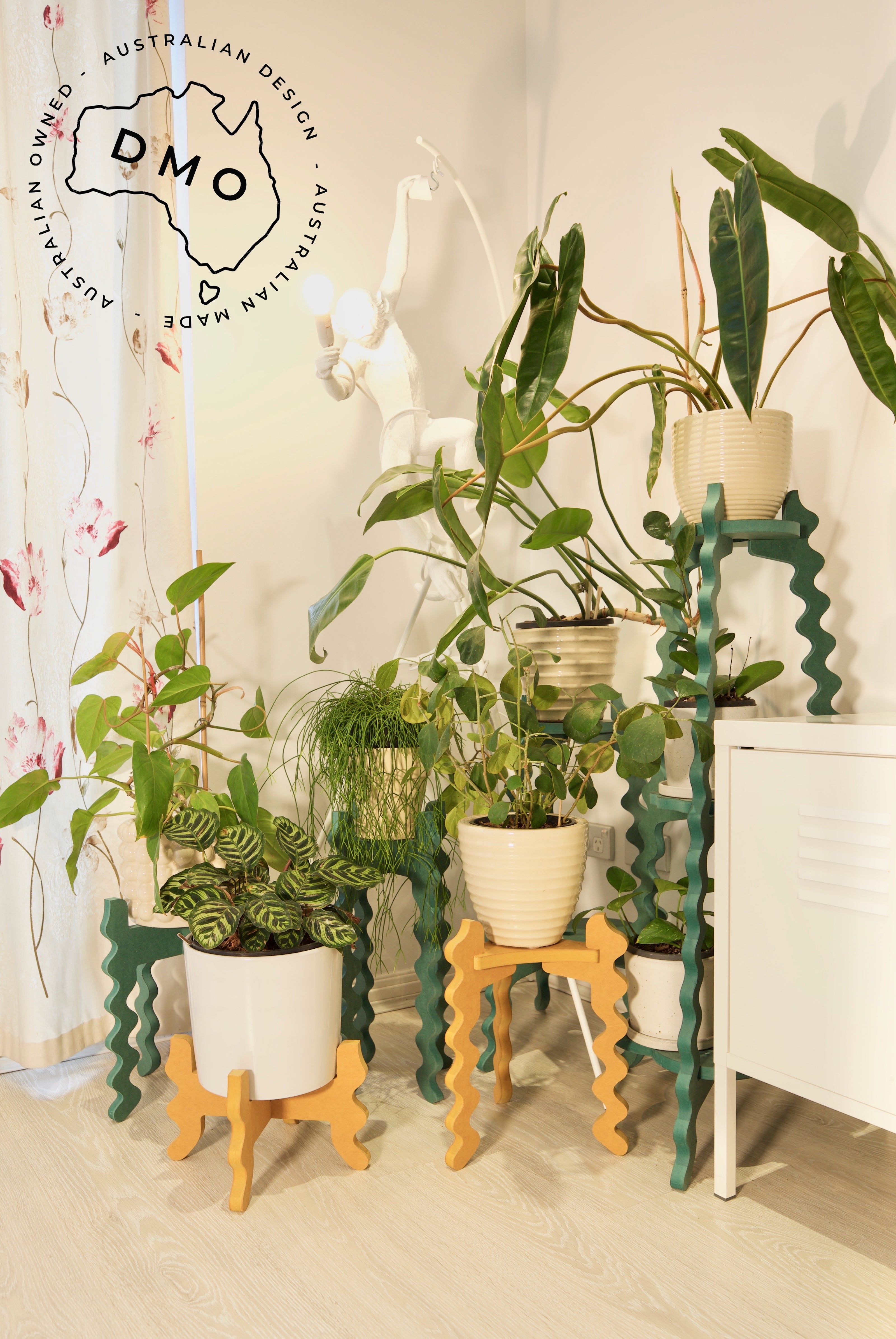 Xigglie indoor plant stands.  Australian designed and made, in yellow and green moisture resistant MDF. Support plants in modern living room.