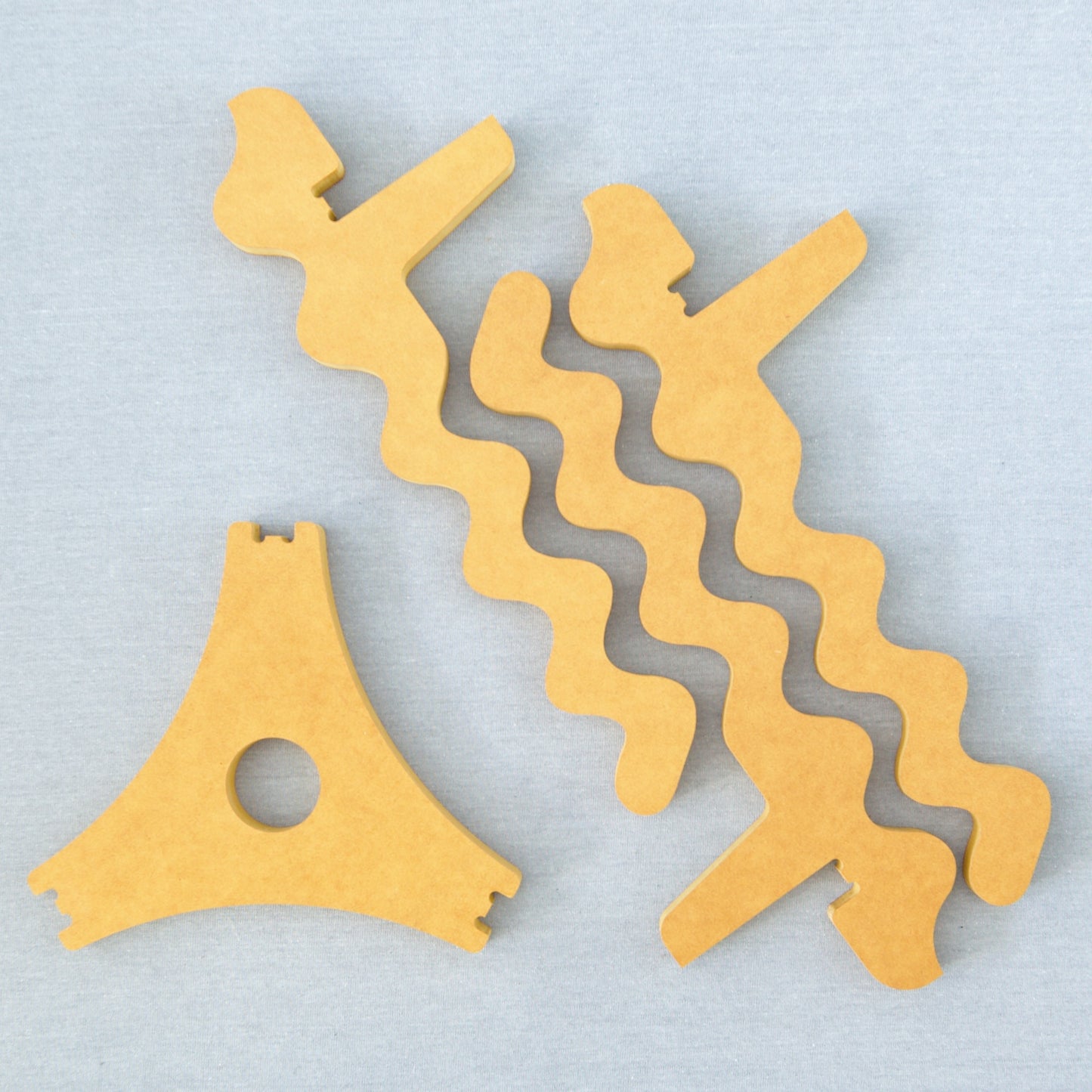 Xigglie Saffron Trio Plant Stand, before assembly. Australian designed and made in yellow moisture-resistant Forescolor board.