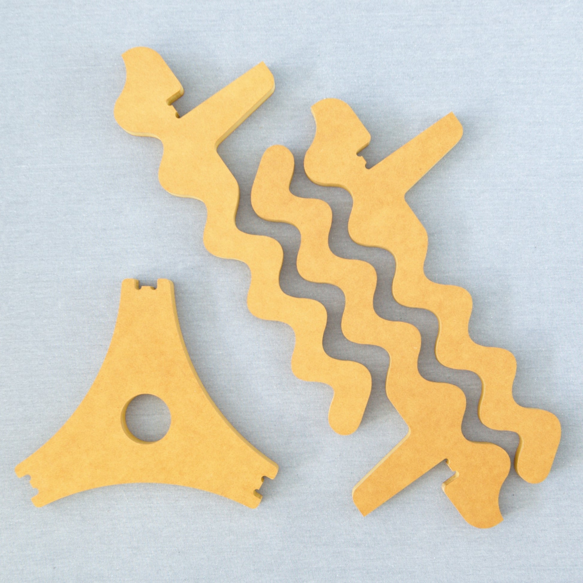 Xigglie Saffron Trio Plant Stand, before assembly. Australian designed and made in yellow moisture-resistant Forescolor board.